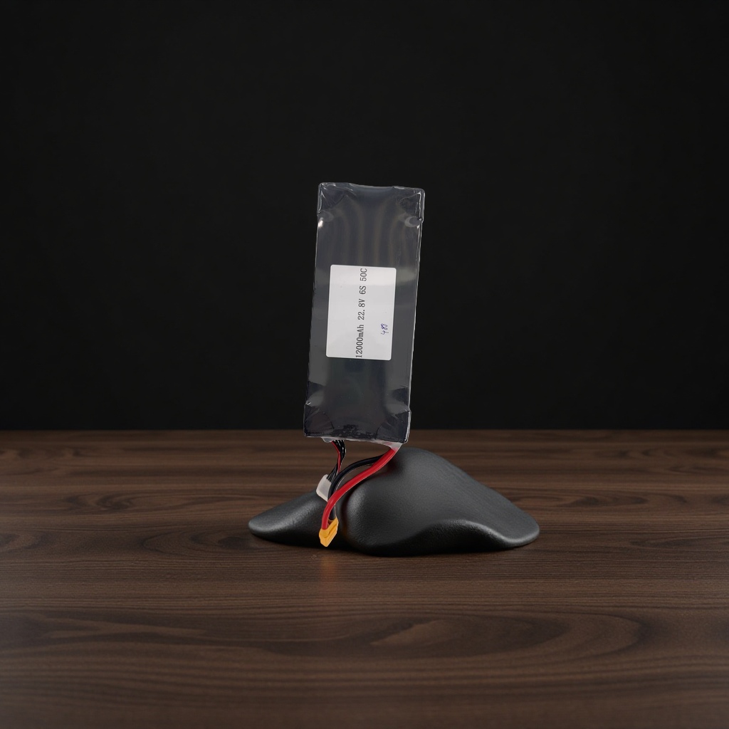 A black battery pack with red and black wires and a yellow plug