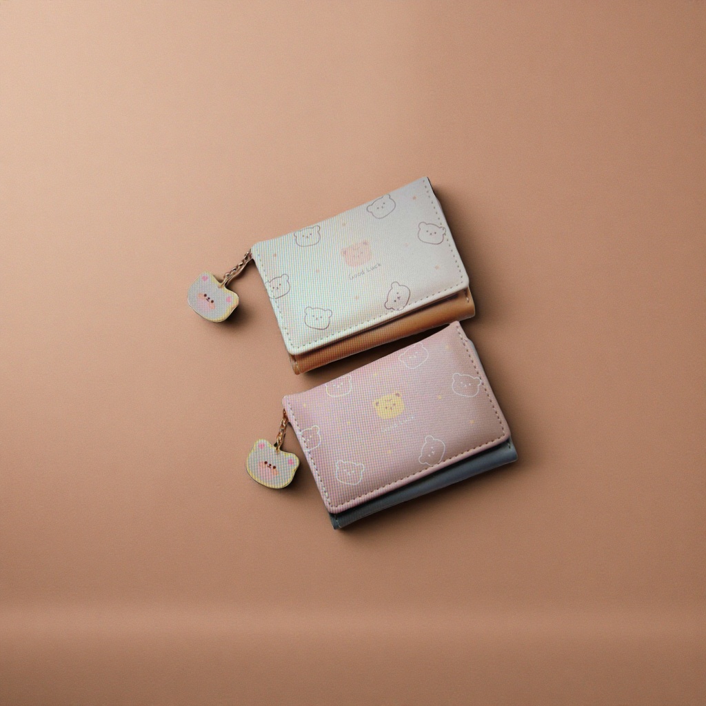 A pink and beige bear 30% off wallet with a cute pendant