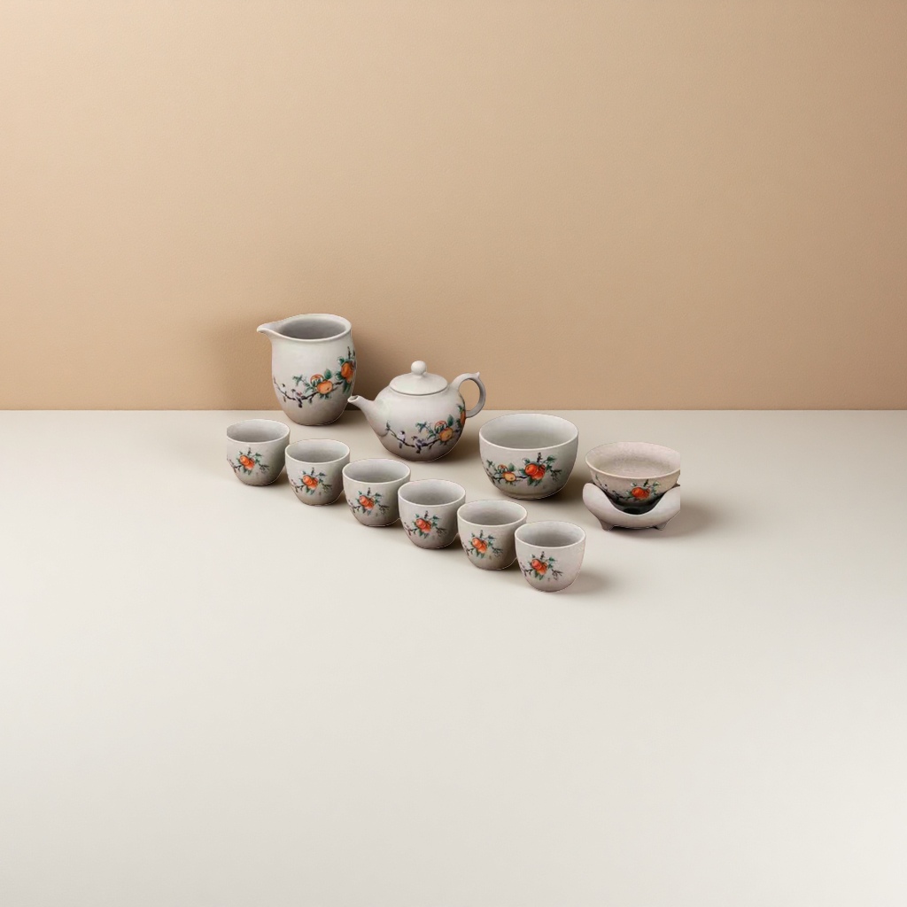 The celadon tea set includes a teapot, fair cup, tea cups, tea bowls, tea saucers, and an orange blossom branch painted beige gift box