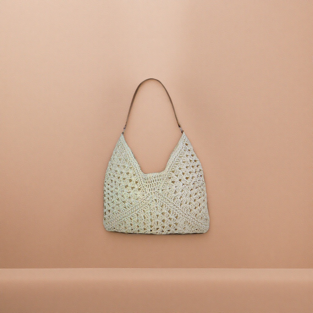 This off-white crochet handbag is a casual and artistic single-shoulder crossbody bag for women
