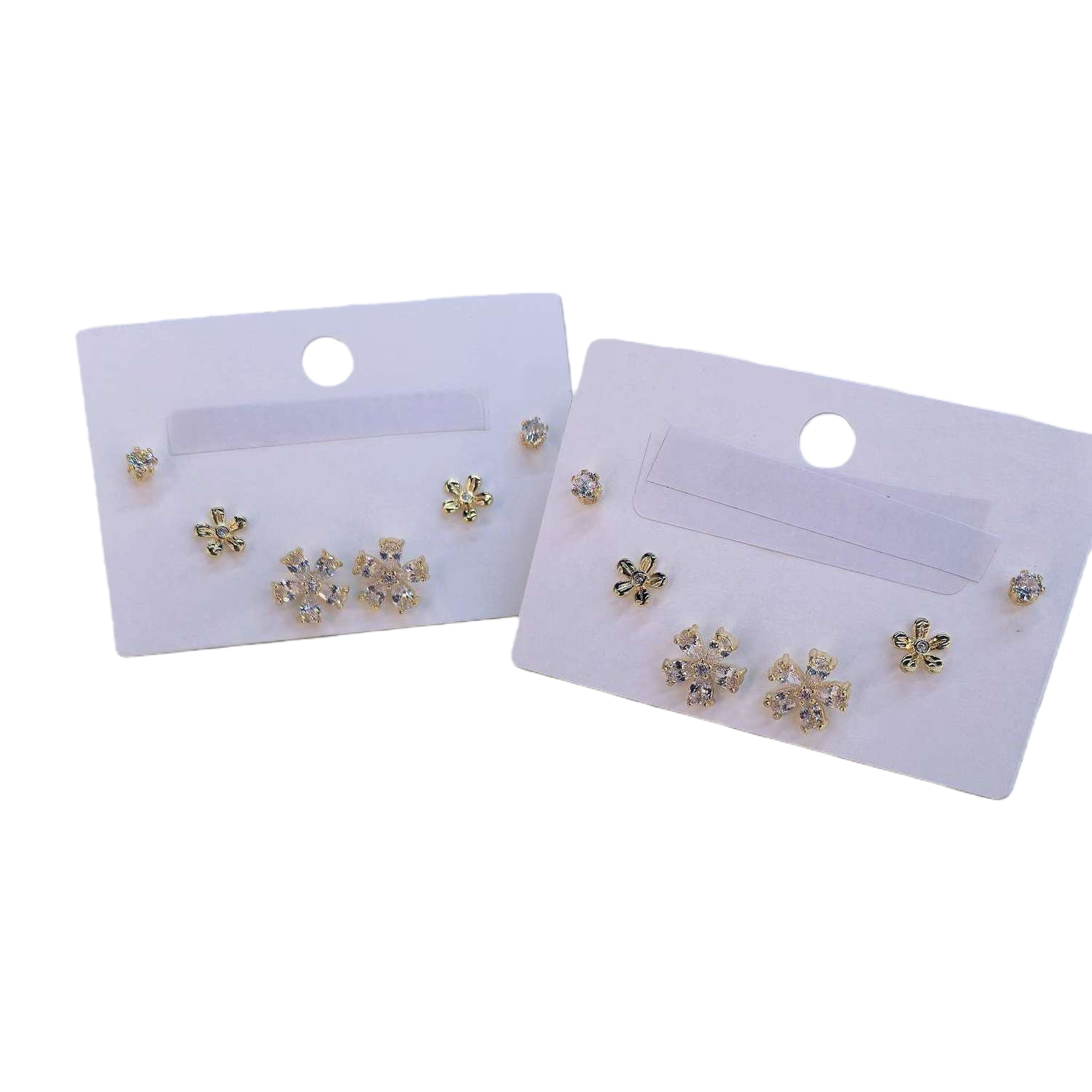 Golden diamond-encrusted flower snowflake ear studs three-in-one five-petal flower-shaped earrings, white desktop style Application Scenario