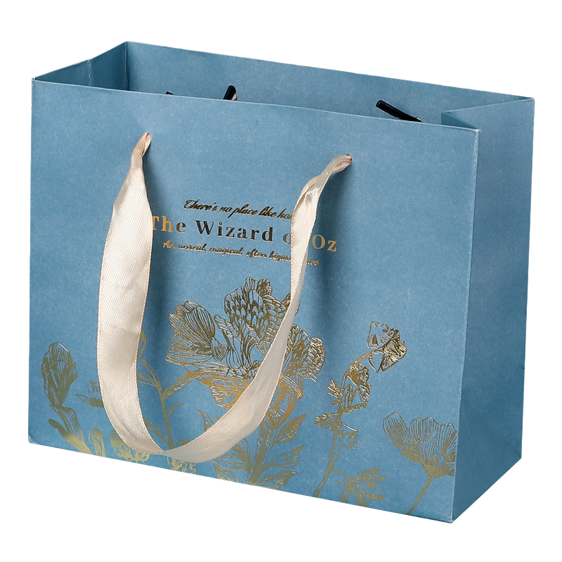 A blue gift bag with a beige ribbon handle featuring golden floral patterns Item Picture