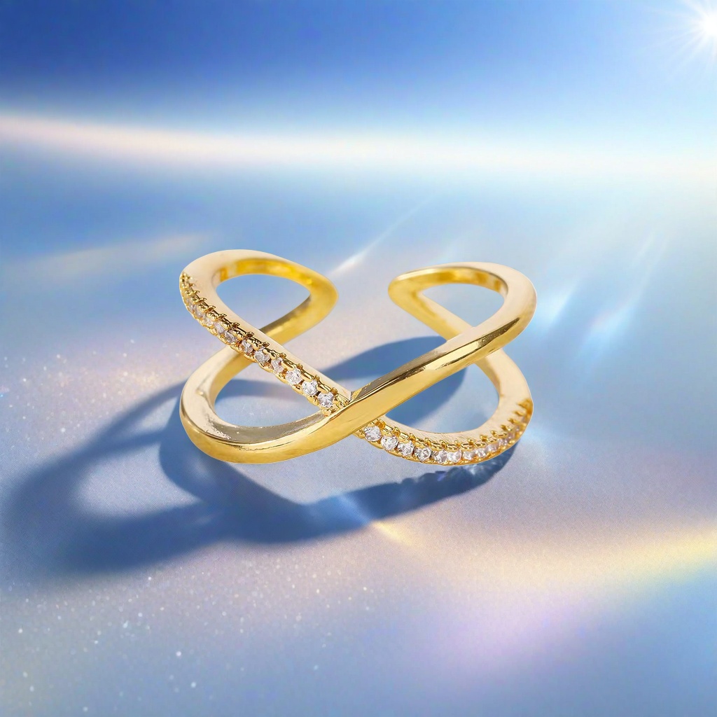 A simple and fashionable lady's ring with a golden cross set with small crystal stones