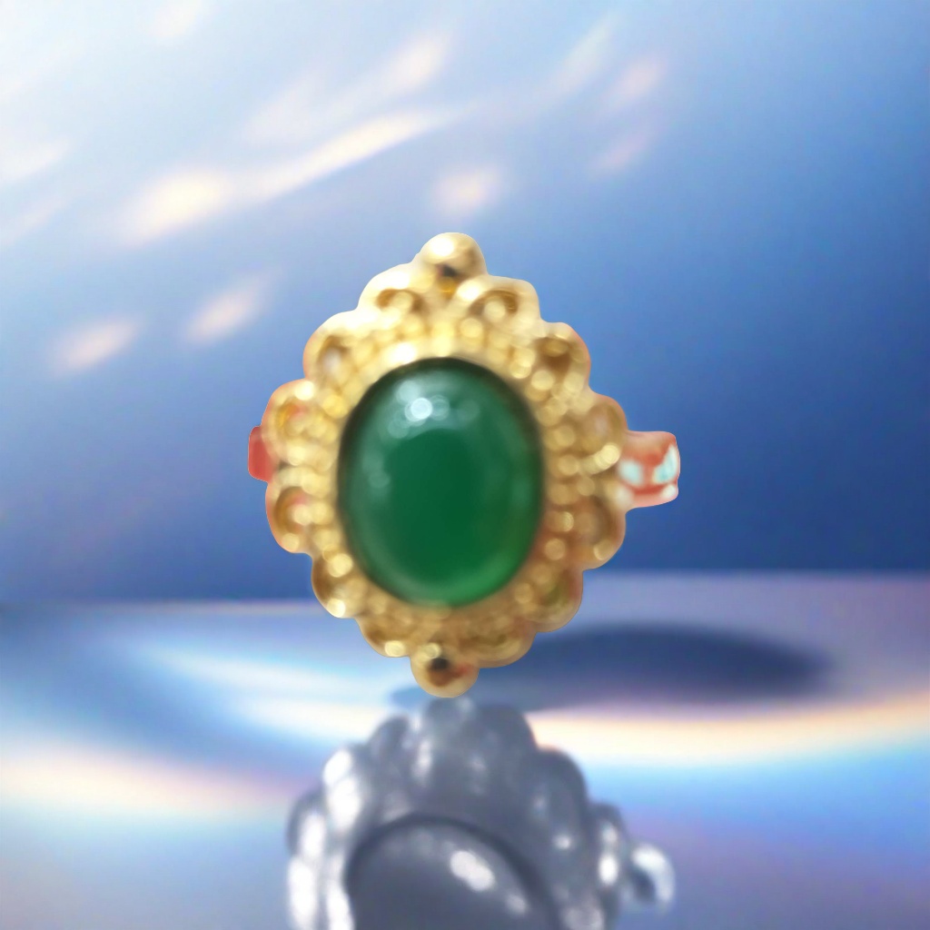 A simple and fashionable lady's ring with a golden ring and green gemstones