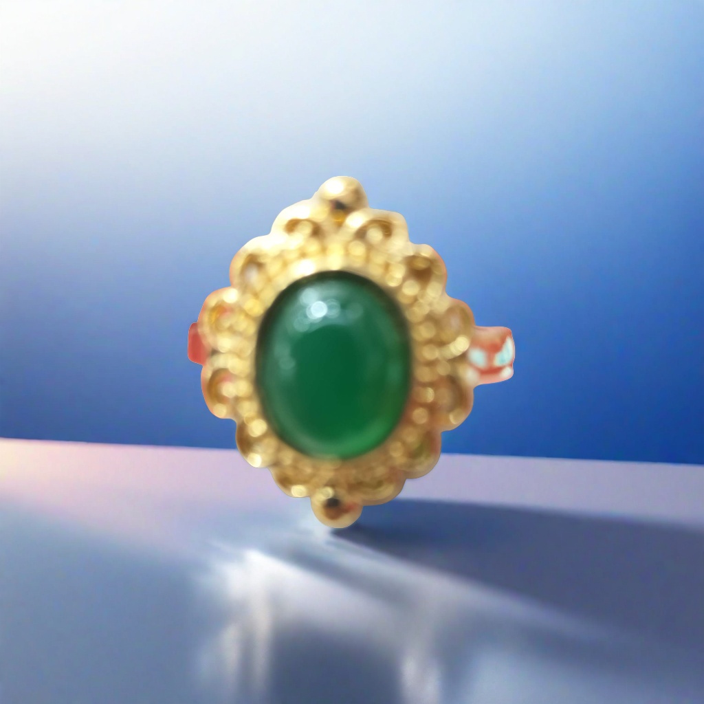 A simple and fashionable lady's ring with a golden ring and green gemstones details Picture