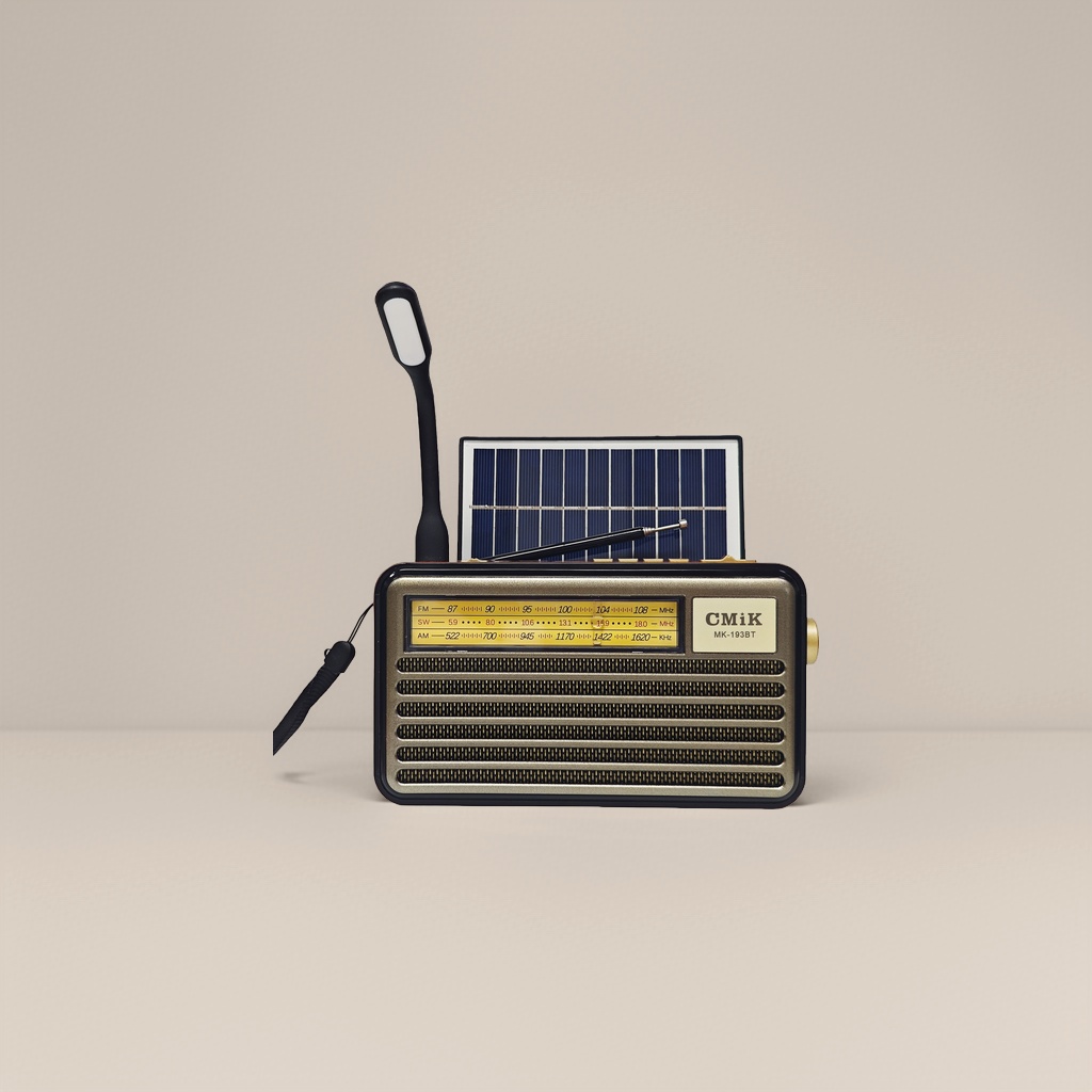 A golden vintage radio with solar panels and LED lights, integrating radio reception, playback and lighting