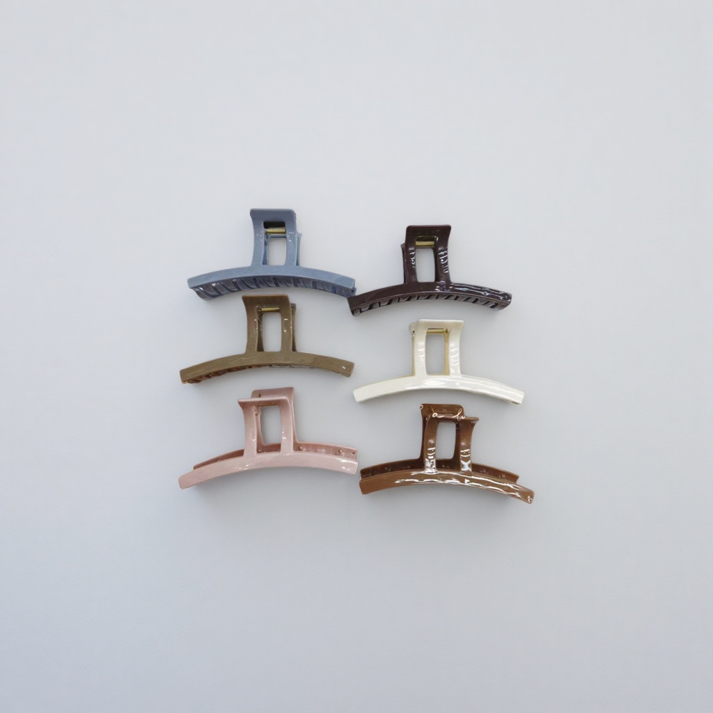 A set of six colorful hairpins with white striped trays for display details Picture
