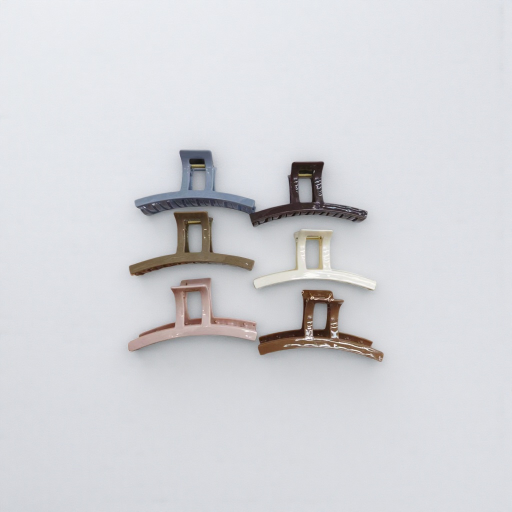A set of six colorful hairpins with white striped trays for display