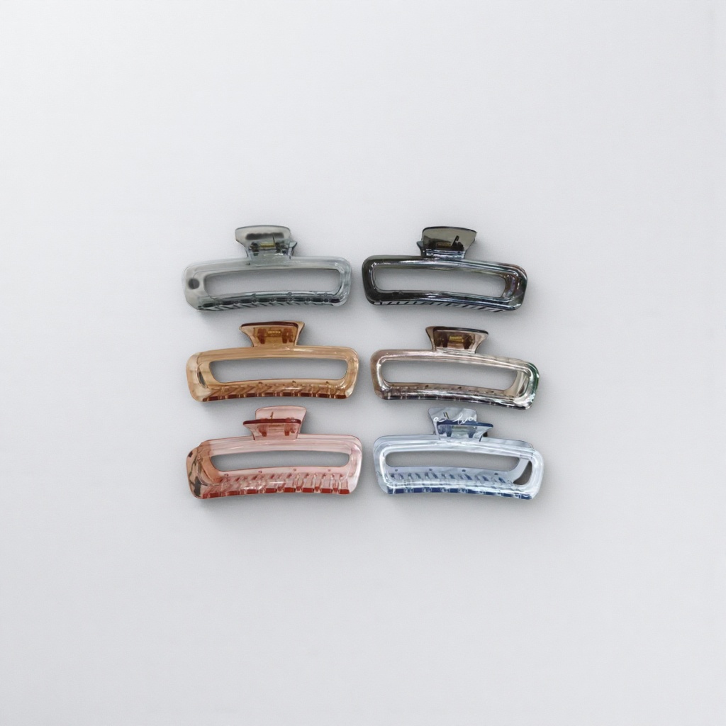 A six-color transparent plastic gripper set is displayed on a white striped tray