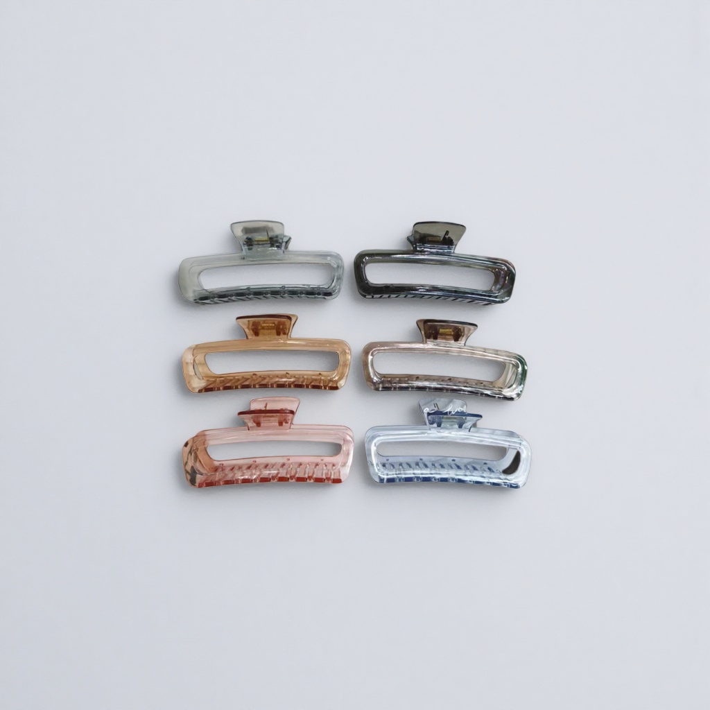 A six-color transparent plastic gripper set is displayed on a white striped tray details Picture