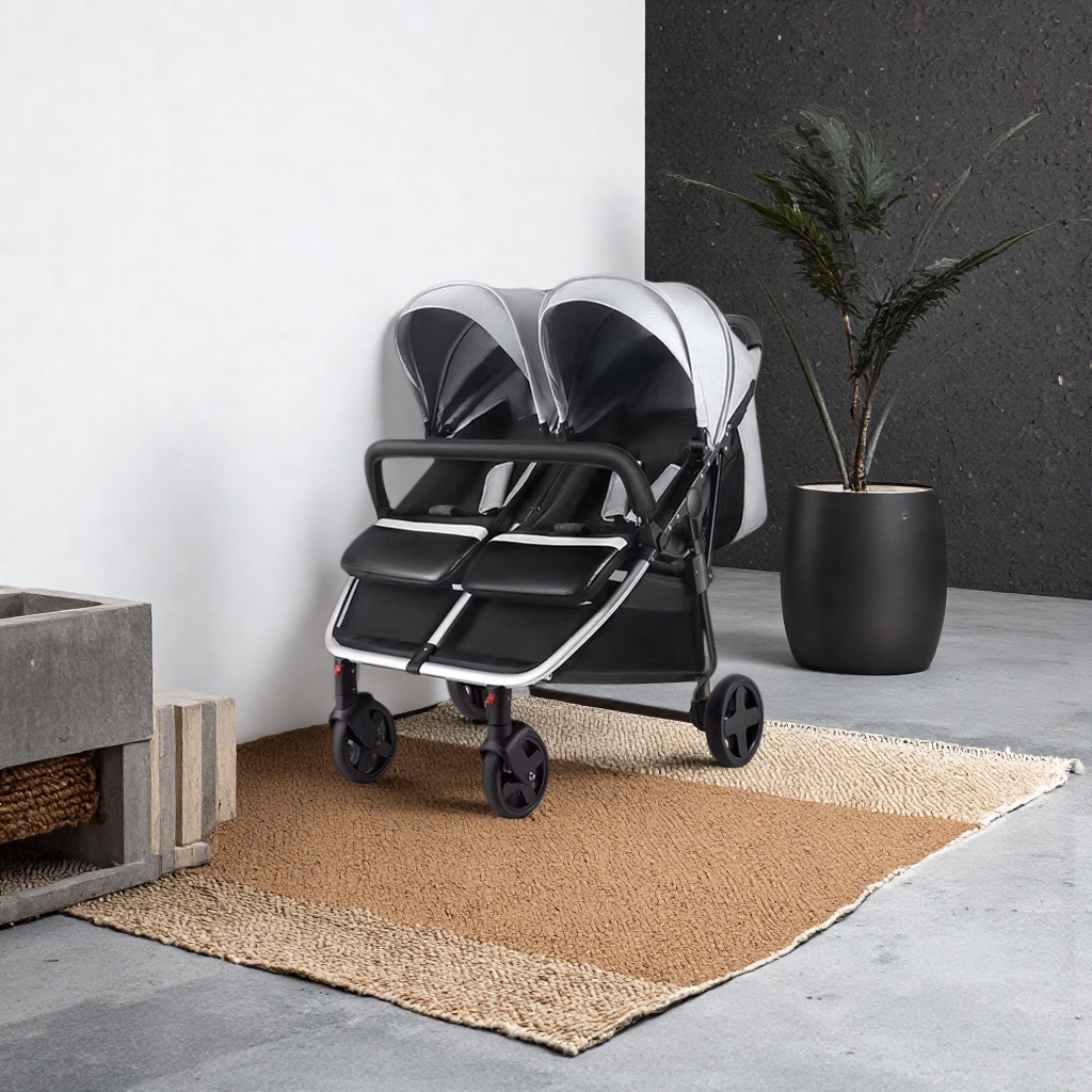 The silver and black twin baby stroller can be used for sitting or lying down, and can be pushed in both directions with light folding