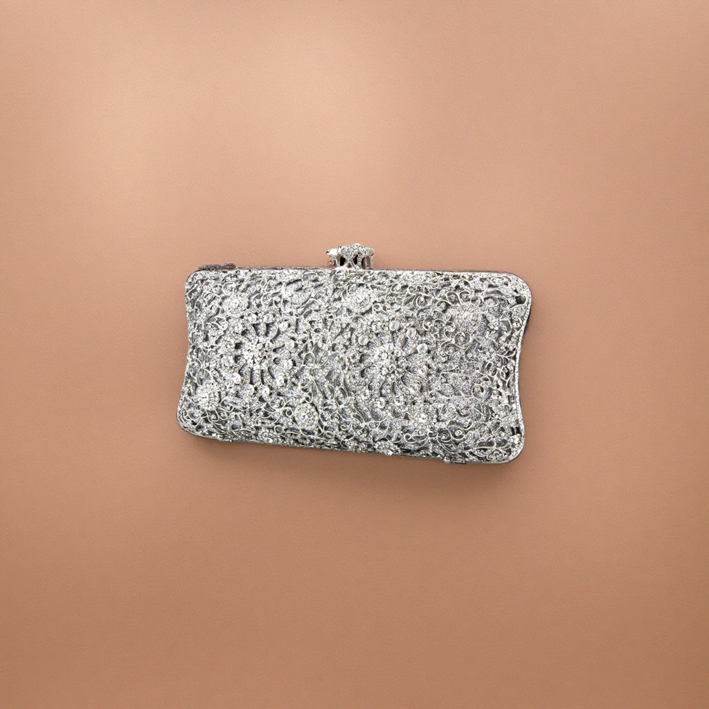 The silver diamond-encrusted and carved clutch is small and portable for ladies' dinner parties Specification image