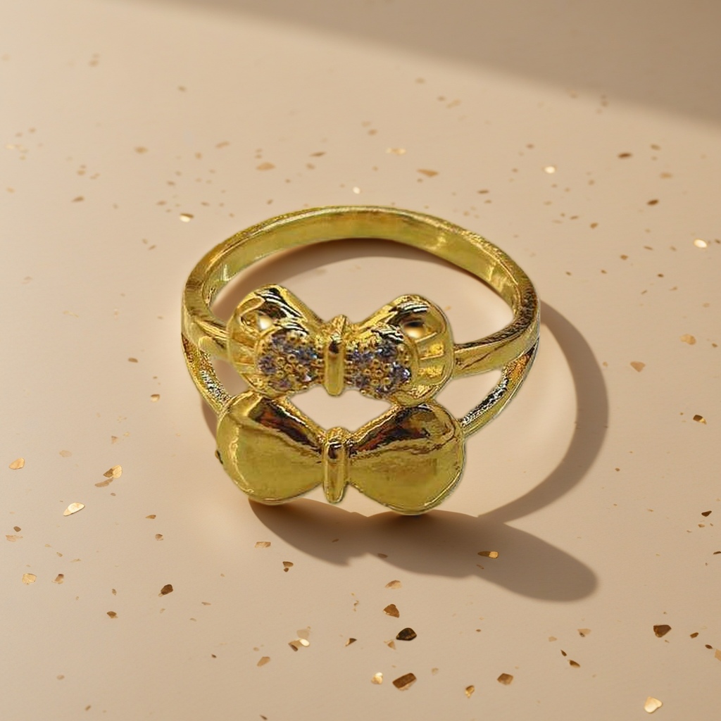 A golden bow-shaped ring is a fashionable and simple ladies' accessory Specification image