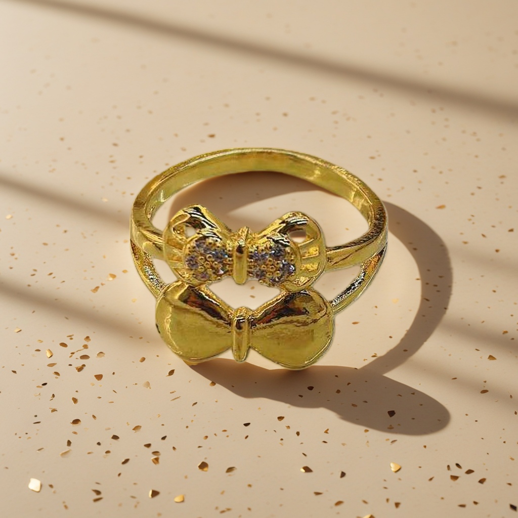 A golden bow-shaped ring is a fashionable and simple ladies' accessory details Picture