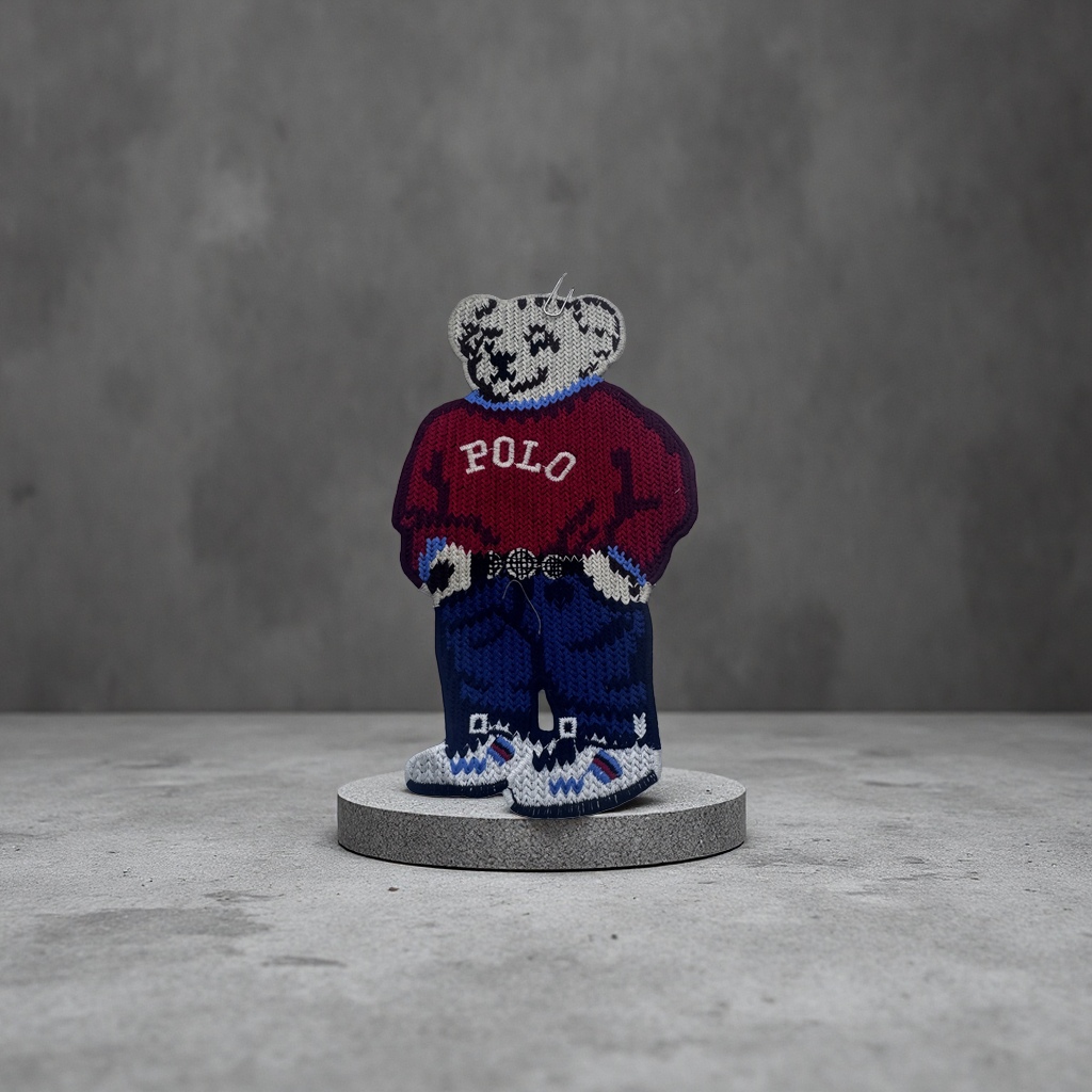 A cute knitted bear-shaped badge with a plush texture and a metal pin as an adorable accessory Application Scenario
