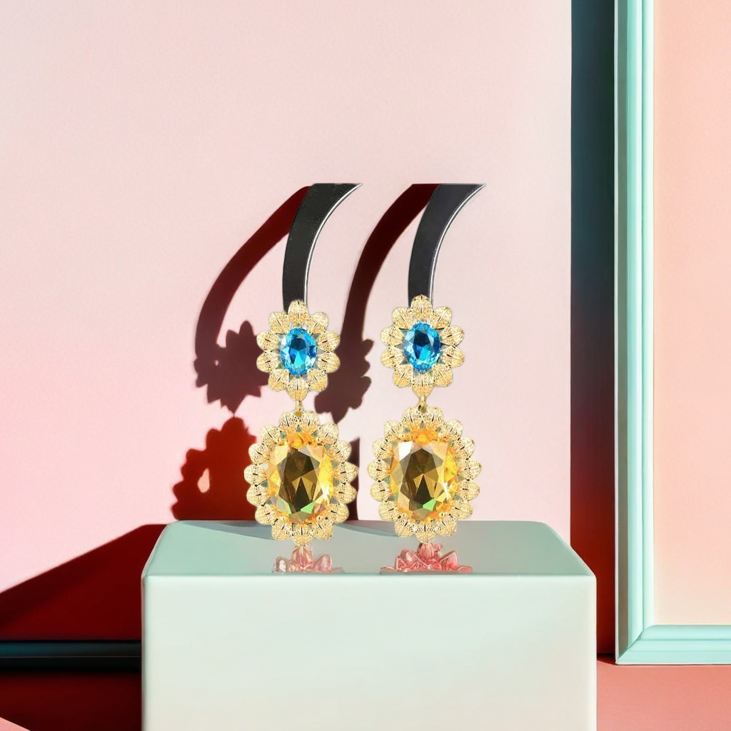 Golden flower-shaped earrings set with blue and yellow bicolor gemstones