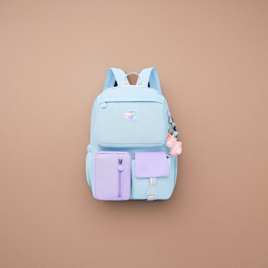 A light blue backpack with a purple unicorn pendant in the front pocket Application Scenario