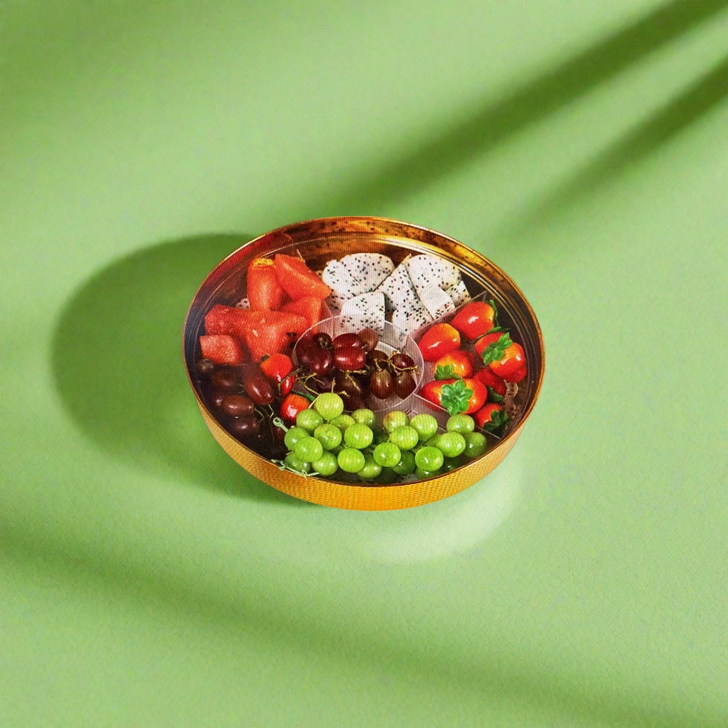 A golden fruit platter with compartments holds various fruits. It's a home living room coffee table fruit platter Application Scenario