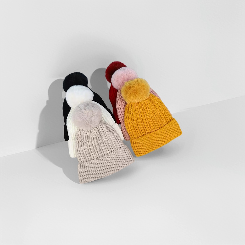 A colorful woolen cap decorated with pom-poms for warm autumn and winter knitted hats details Picture
