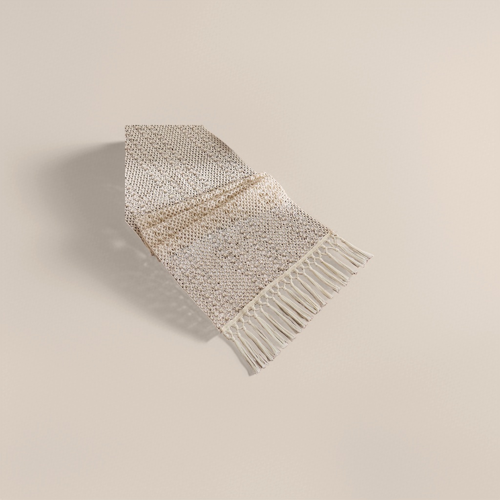 The off-white crochet table flag is fringed with tassels
