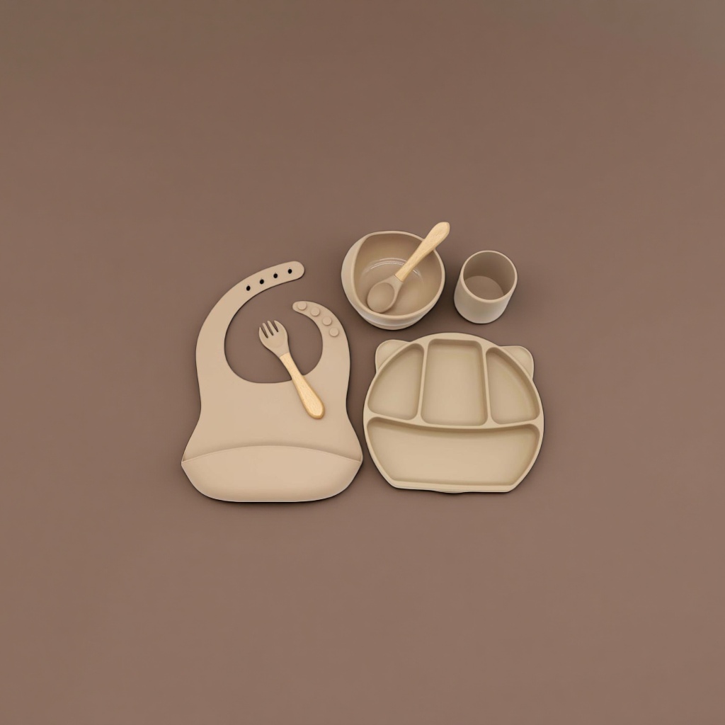 Beige silicone baby tableware set with bibs, compartments, plates, bowls and cups, and wooden handles details Picture