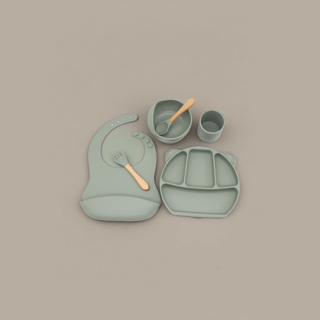 Green silicone baby tableware set with bibs, compartments, plates, bowls, cups, wooden handles, forks and spoons Application Scenario