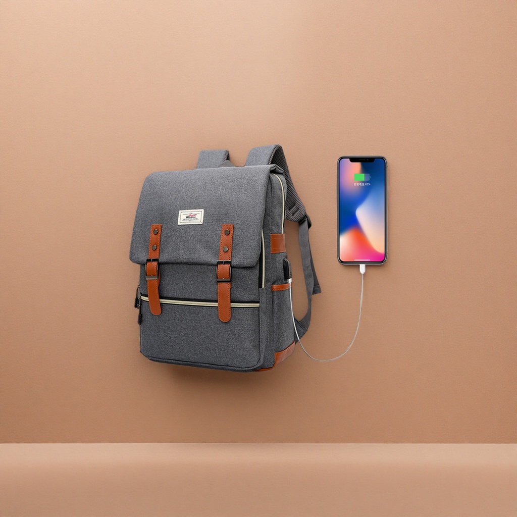 A grey backpack with brown leather trim and a USB charging port for mobile phone charging