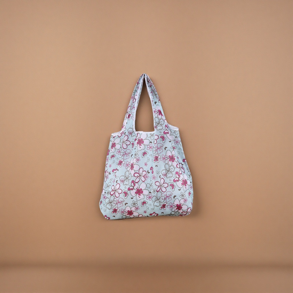 Light blue floral patterned foldable shopping bag with large capacity, lightweight and environmentally friendly hand-carry Application Scenario