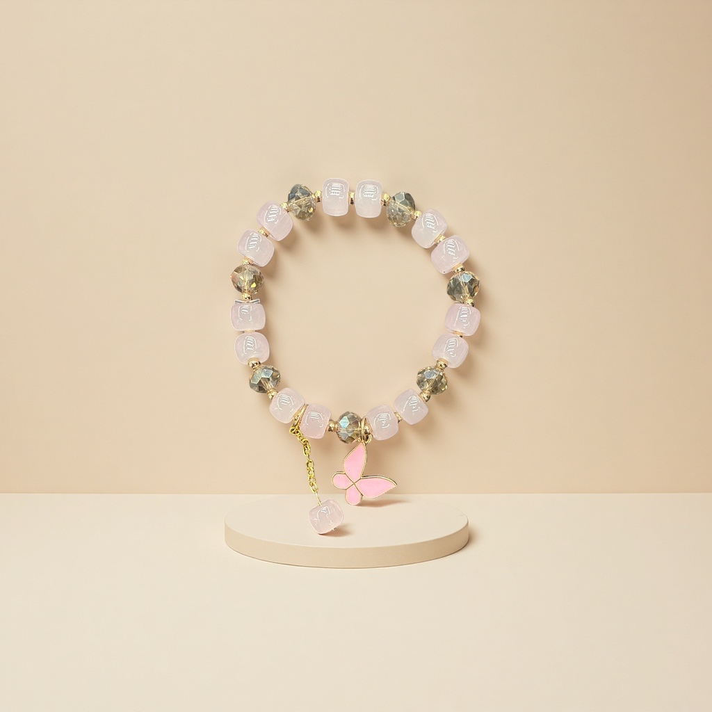 A pink beaded bracelet with a golden butterfly pendant is a fashionable and simple ladies' accessory
