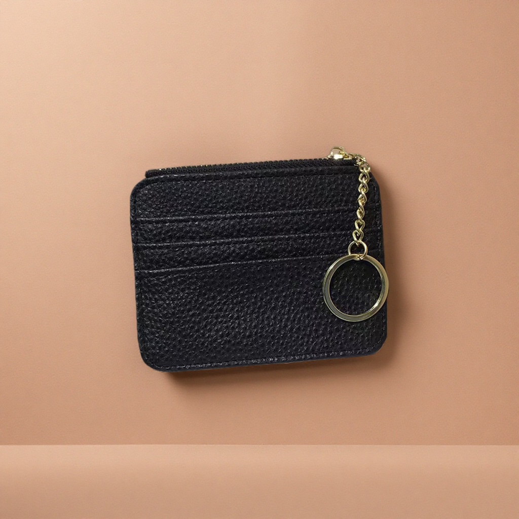 A fashionable and light luxury handbag for women with a black textured wallet and a golden chain keychain