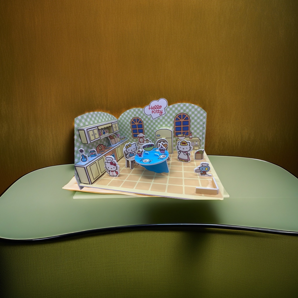 Hello Kitty pink kitchen paper art model with blue dining table, yellow cabinets, green checkered wall and character kitchenware ornaments Application Scenario