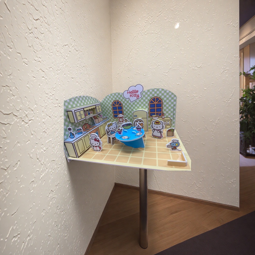 Hello Kitty pink kitchen paper art model with blue dining table, yellow cabinets, green checkered wall and character kitchenware ornaments details Picture