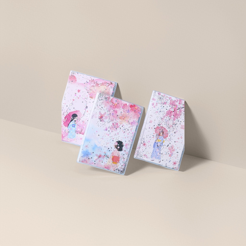 Pink cherry blossom-themed sand notebook with illustrations of three girls in kimonos holding umbrellas