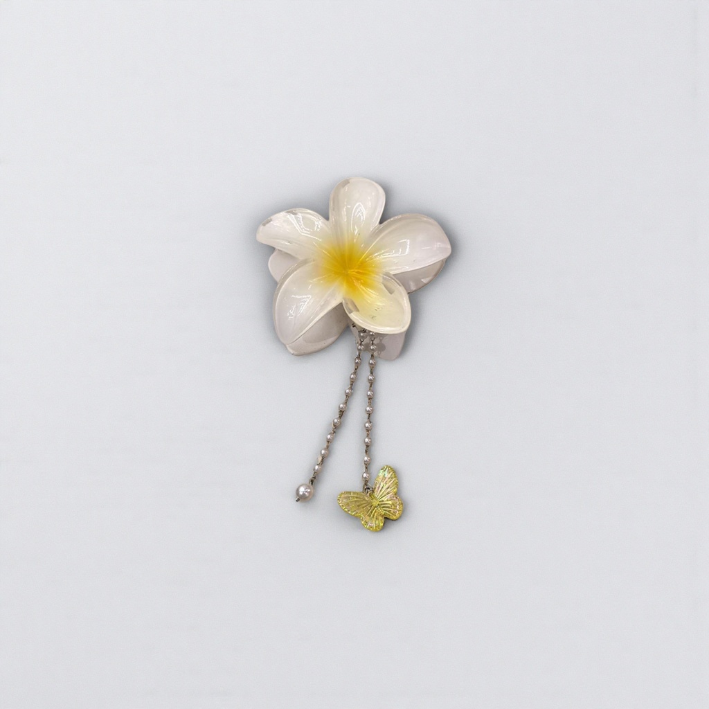 White flower-shaped hairpins with pearl chains and yellow butterfly pendants