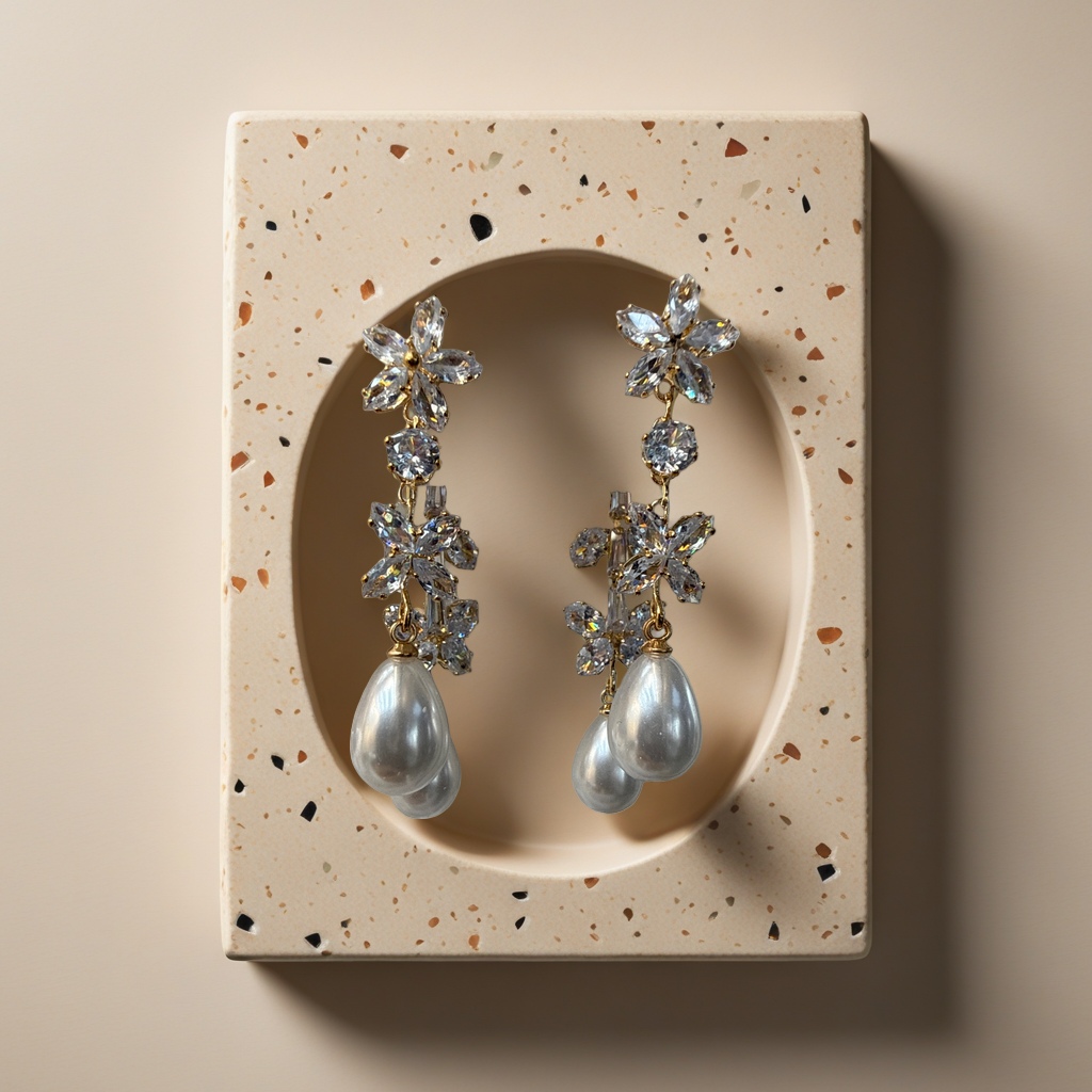 Golden flower-shaped crystal earrings adorned with pearl pendants are light luxury and elegant ladies' accessories