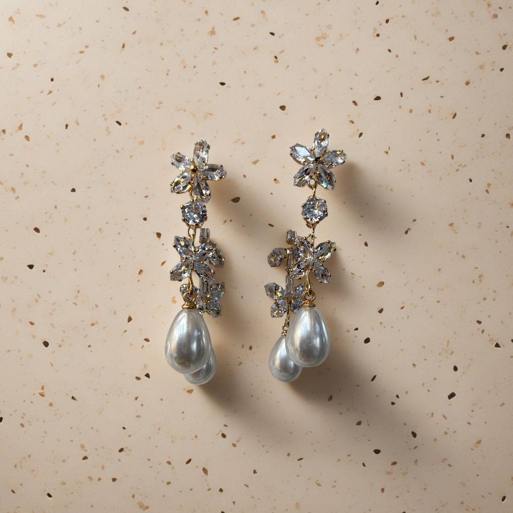 Golden flower-shaped crystal earrings adorned with pearl pendants are light luxury and elegant ladies' accessories details Picture