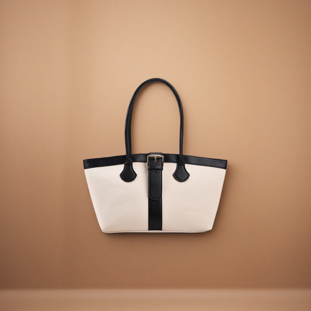 A casual single-shoulder bag in off-white canvas with a black leather handle decorative strap Application Scenario