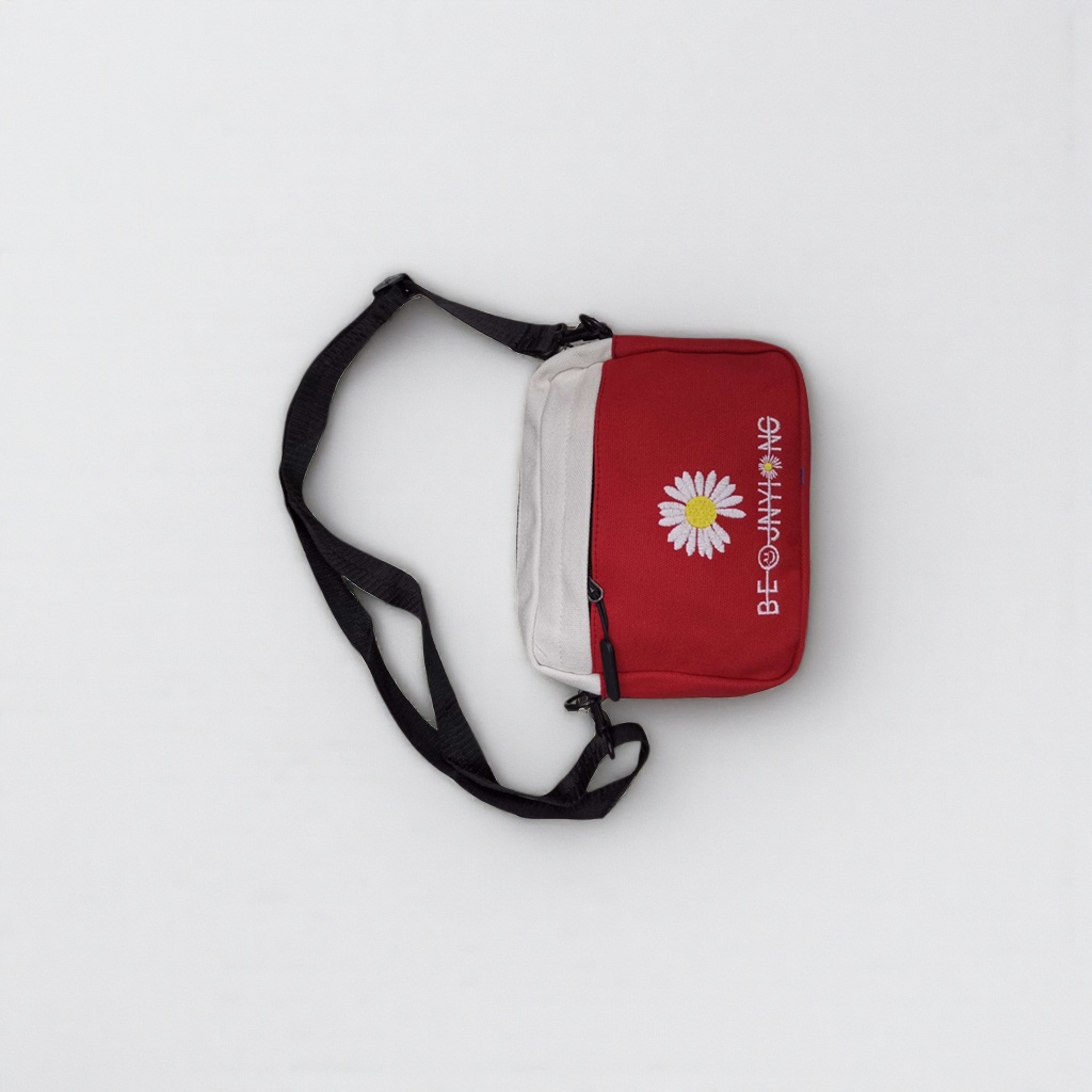 Red and white crossbody bag with white Daisy embroidery BE@JNYI NG and black adjustable shoulder strap