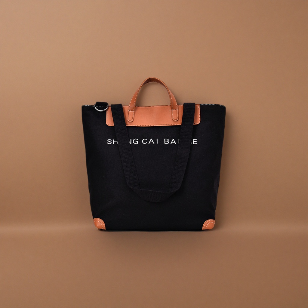 Black canvas tote bag, brown leather handbag, corner white SHANG CAI BA letters details Picture