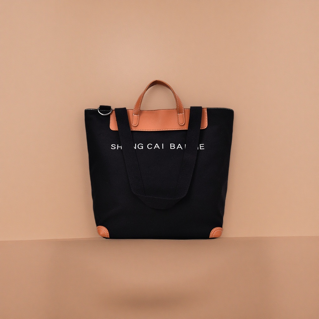 Black canvas tote bag, brown leather handbag, corner white SHANG CAI BA letters Specification image