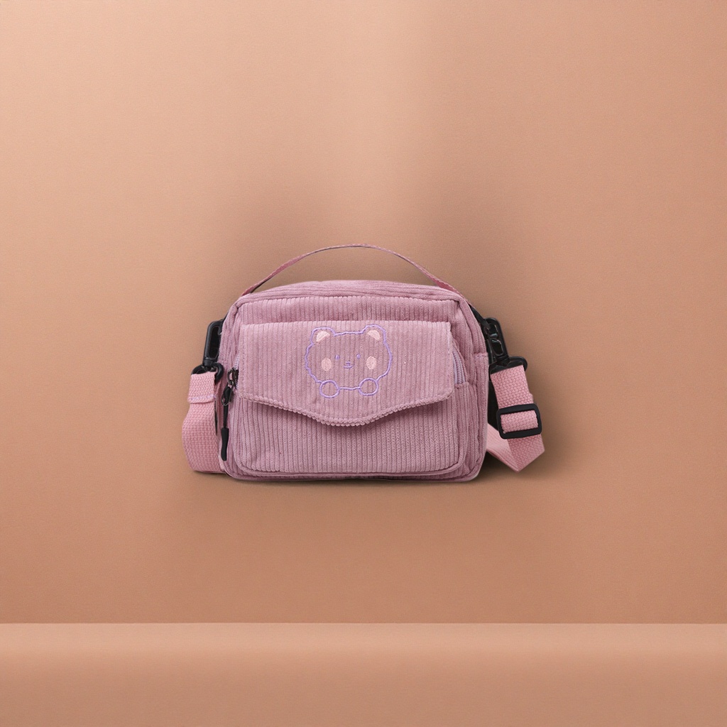 The pink corduroy bear-shaped crossbody bag is fashionable, versatile and lightweight for easy travel