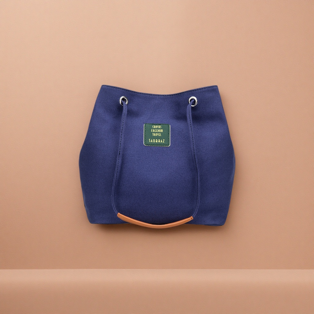 A simple and versatile single-shoulder tote bag with a deep blue canvas