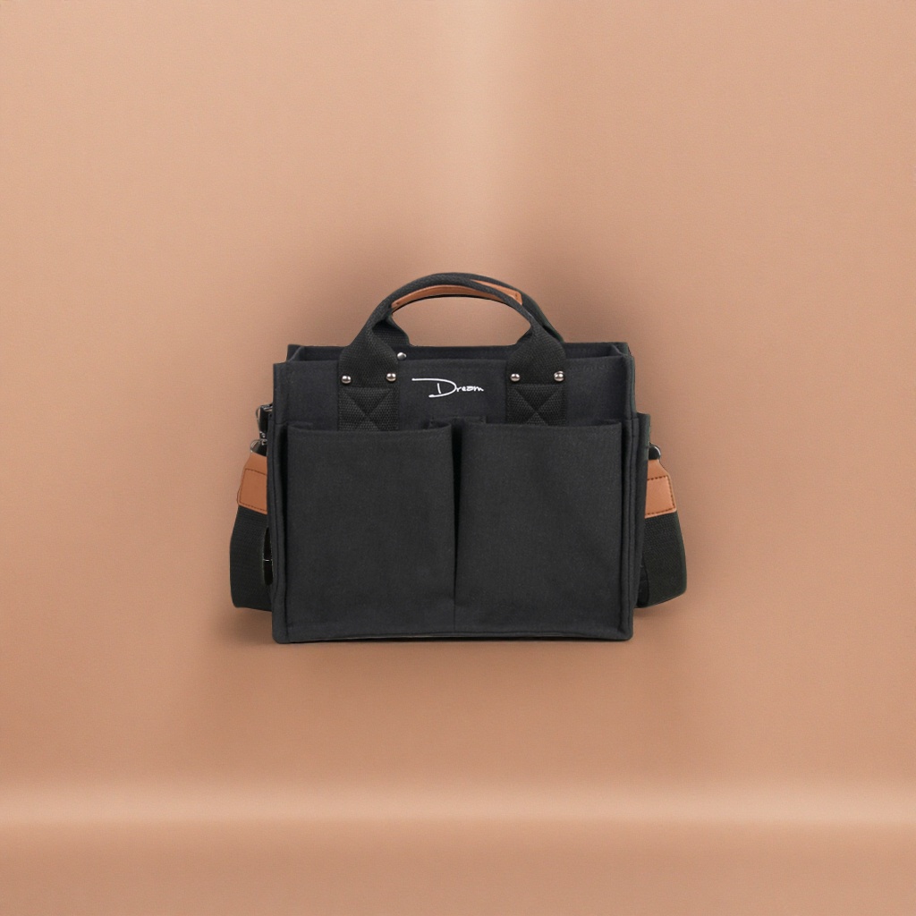 This black canvas bag is simple and versatile, with a large capacity for commuting and casual use. It is a single-shoulder crossbody bag
