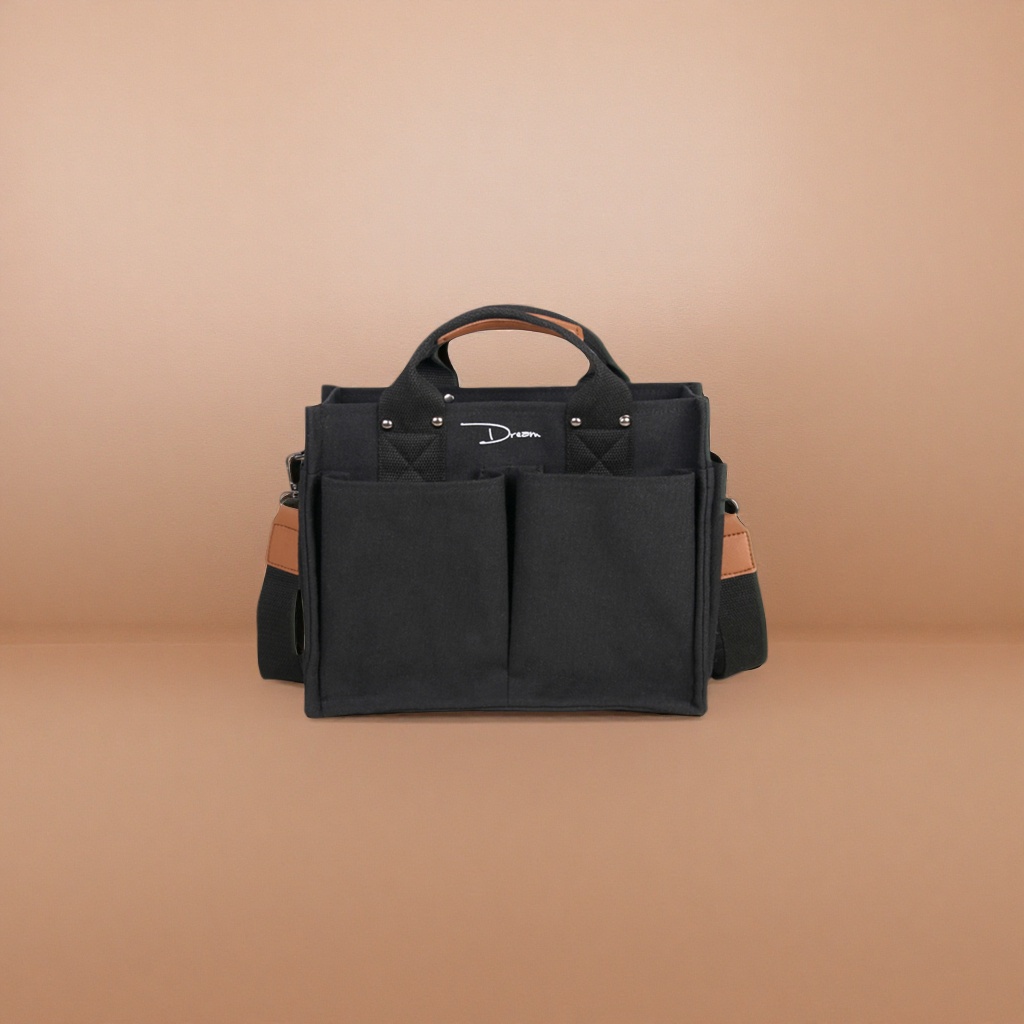 This black canvas bag is simple and versatile, with a large capacity for commuting and casual use. It is a single-shoulder crossbody bag details Picture