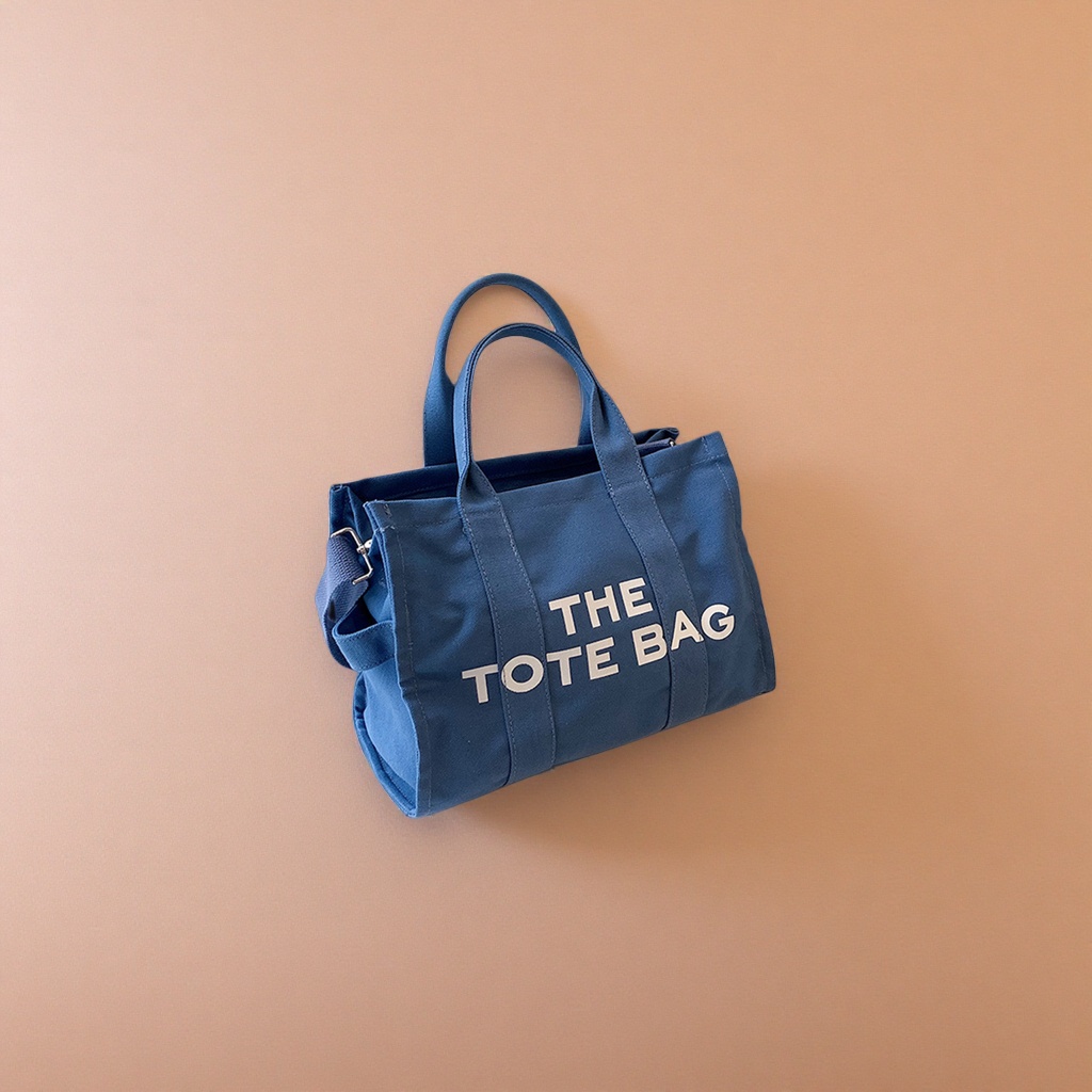 The blue canvas tote bag is a large-capacity commuting shopping handbag that is simple and versatile details Picture