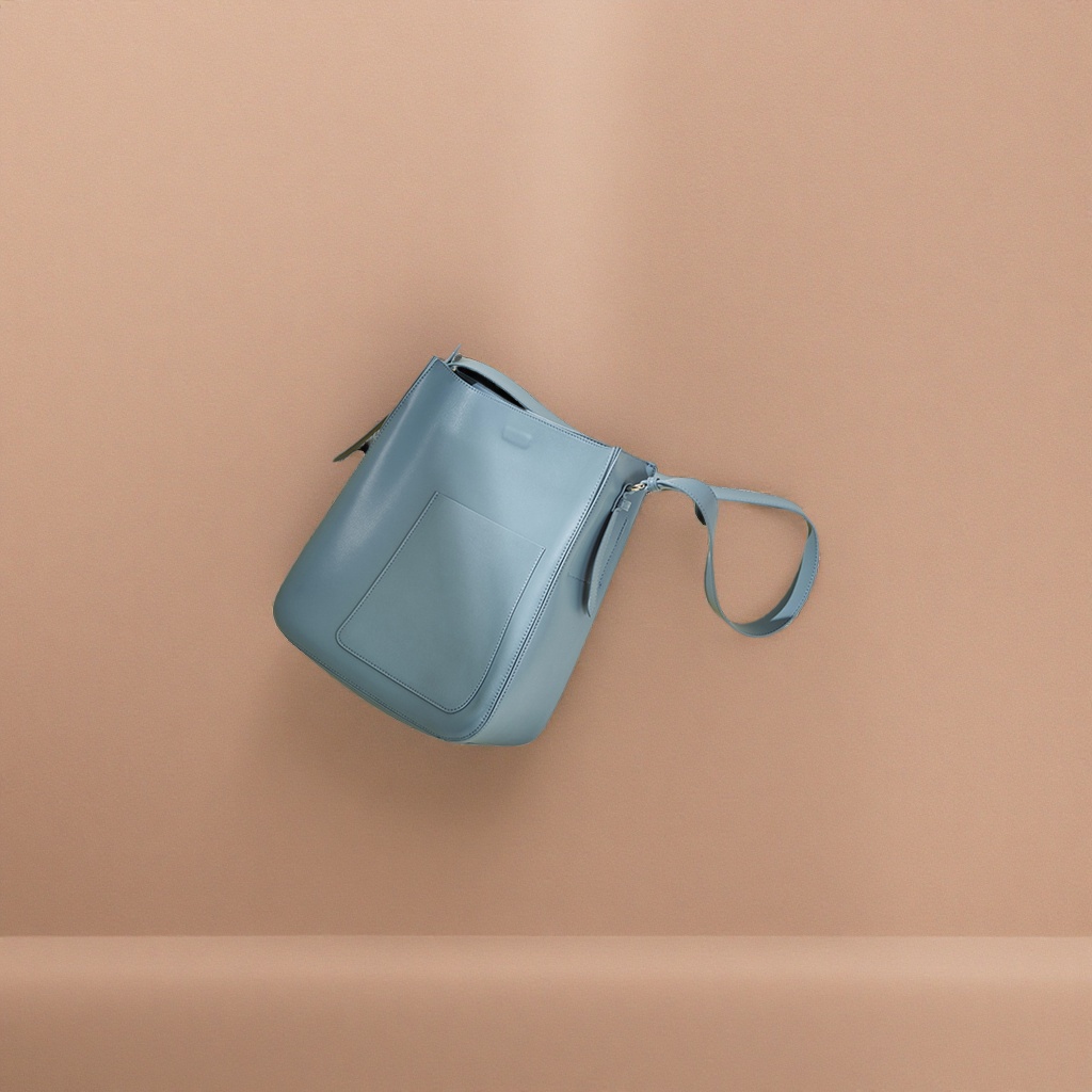 The light blue leather bucket bag is a niche design for women's single-shoulder crossbody wear, which is lightweight and versatile