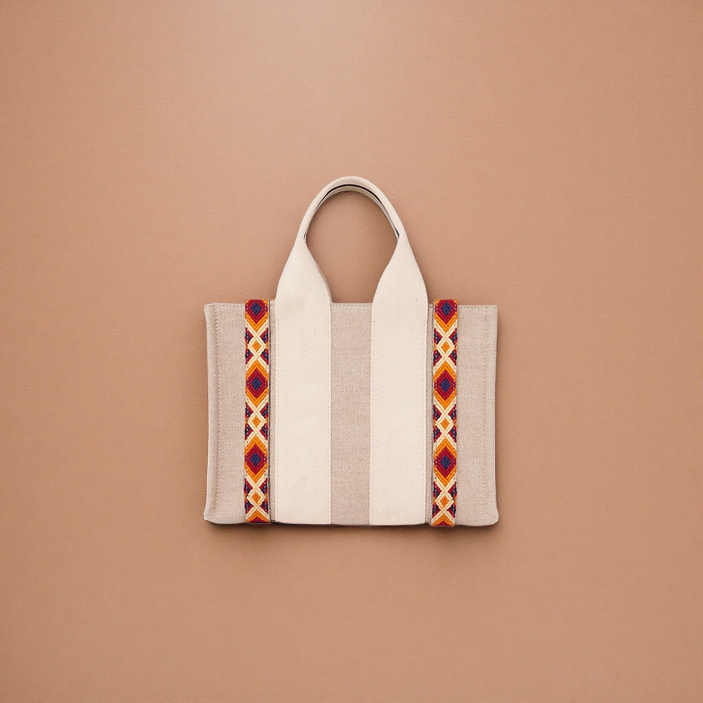 The beige canvas handbag has orange-red and blue geometric patterned webbing on both sides Application Scenario
