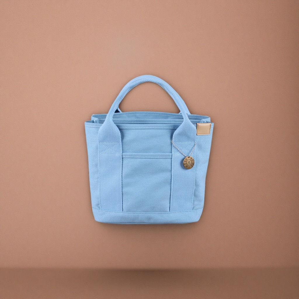 A light blue canvas handbag, a simple and versatile women's single-shoulder tote bag details Picture