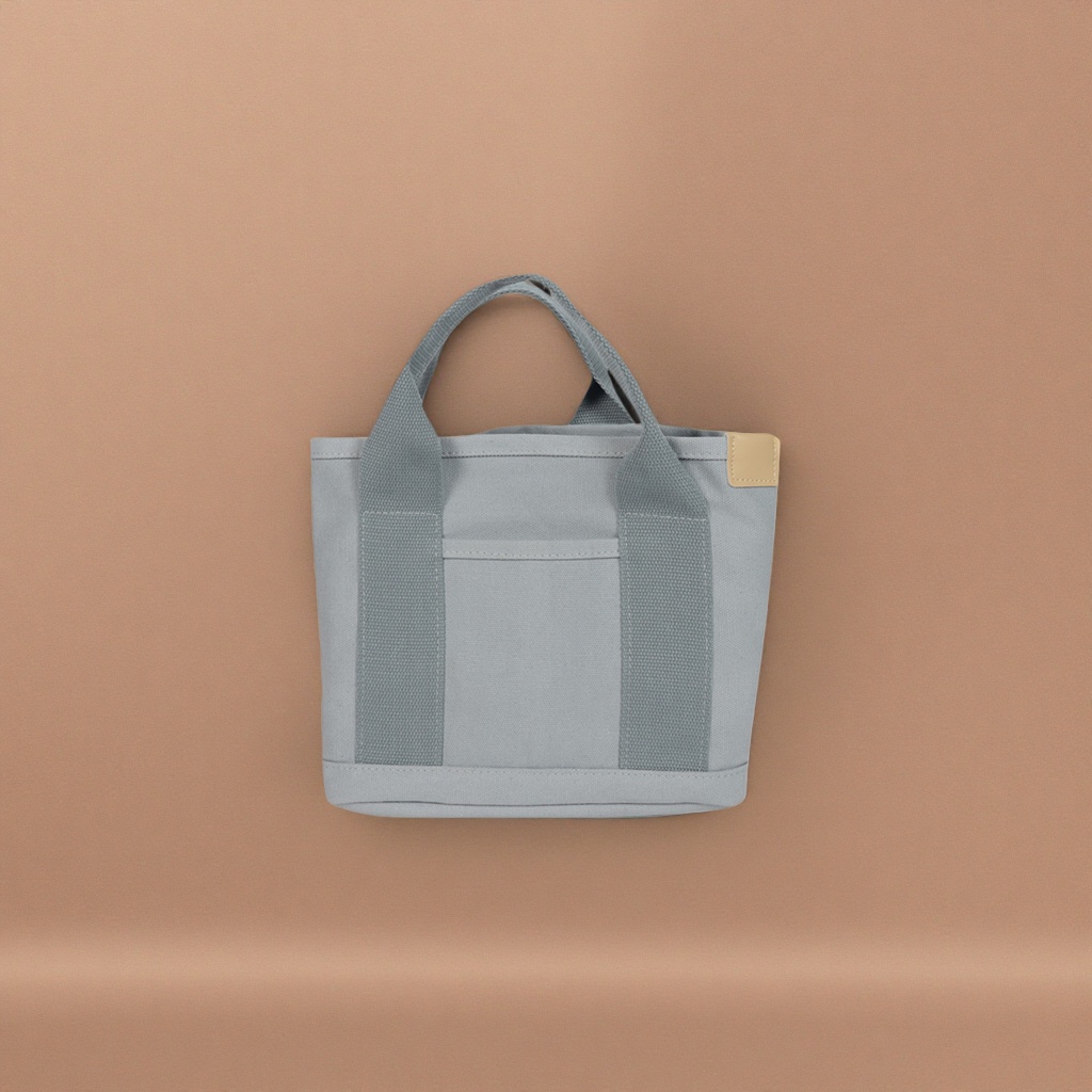 The thickened grey canvas handbag is wear-resistant and practical for daily commuting and business trips for storage