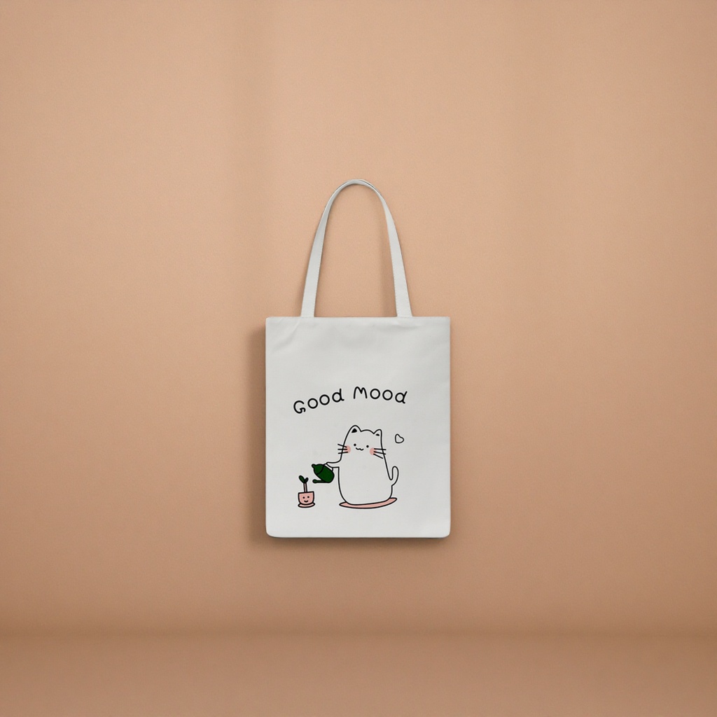 A white canvas bag with a cartoon cat watering pattern and the words "Good Mood" details Picture